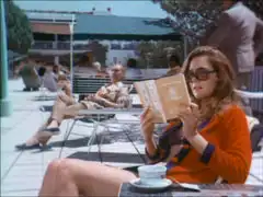 Mrs. Peel relaxes on a sun lounge at the resort