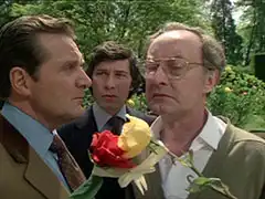 Steed and Gambit visit Roland, who is more interested in the roses he has tied together in order to make a new hybrid