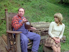 Purdey looks nervous as the hillbilly takes another swig from his jug of moonshine