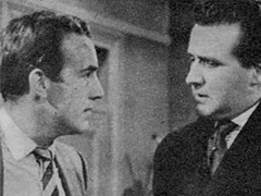 Publicity still from <em>TV Times</em> - Dr. Keel and Steed discuss the case in Keel’s surgery