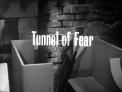 title card: Tunnel of Fear superimposed on a ghost train car entering the ride