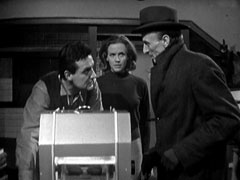 Steed on the left and Cathy centre question Dr. Ashe about his experiments