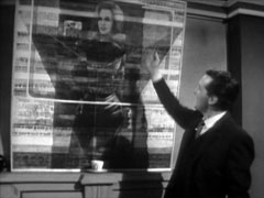 Steed gestures at a Modernist portrait of Cathy that he had commissioned