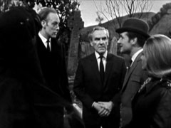 Steed and Cathy are all smiles as they confront the veiled Mrs. Tyurner, Hopkins and Dr. Maccombie in the churchyard
