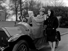 Mrs. Peel is no help with Steed’s crossword - exterior scene of Steed sitting in a vintage car, it’s Winter and they both wear heavy clothes. She offers him one of Armstrong’s cybernaut-attracting pens which he declines