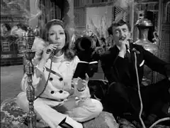 Hopkirk and Emma puff away on hookahs while they chat