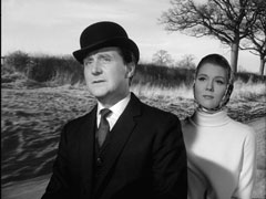 Steed and Mrs. Peel ride away on a tandem bicycle