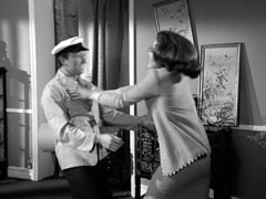 Mrs. Peel fights the laundryman who has helped abduct Dr. Wadkin