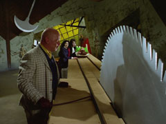 Parody of ‘The Cabinet of Dr. Caligari’ in the set design and ‘The Perils of Pauline’ as Emma inches closer to the whirling buzzsaw