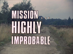 title card: the white all caps text outlined in black has changed to read ‘MISSION... HIGHLY IMPROBABLE’ superimposed on a view of a deserted, dusty country lane