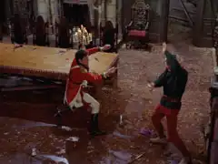 Steed and Wade fight in the main hall
