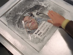 A cryogenically frozen student inside her casket, the label reads Penelope Harwood, age twenty-one, packaged 8–8-67
