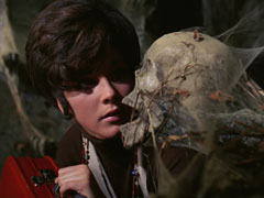 Tara encounters a cobwebbed skull as she enters the Cunningham family crypt