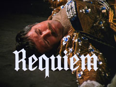 title card: white Old English font reading ‘Requiem’ superimposed on the dead bodyguard, dressed in a ball gown and lying on the garage floor