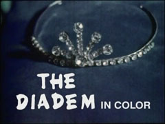 title card : THE DIADEM IN COLOR superimposed on a closeup of a tiara sitting on a blue velvet cushion