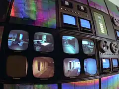 The huge wall of monitors, data banks and tap storage of the Complex