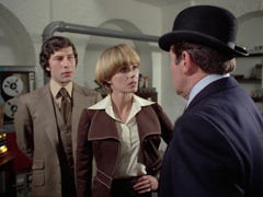 Steed in profile on the right in his bowler hat, Gambit and Purdey face us - and him as they discuss Mason’s kidnapping