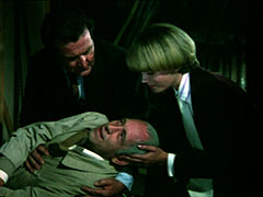 Purdey cradles the head of the injured Gunner as he gasps, ‘Sixteen years too late’ to Steed