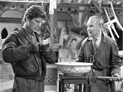 publicity still: Herb and Charlie prepare to torch Andre’s antiques store