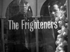 title card: The Frighteners superimposed on Moxon and Nature Boy looking through the shop window
