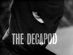 title card: white all caps text reading ‘The Decapod’ superimposed on an extreme close-up of the masked killer