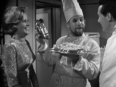 Umberto gives up the fake Italian pose and serves fish and chips to Steed and Cathy