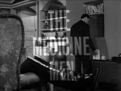 alternate title card: white all caps text reading ‘THE MEDICINE MEN’ superimposed on Steed making coffee in his flat
