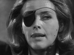 Cathy wears an eye patch after the fight in the printery; she licks her lips as she anticipates the reaction