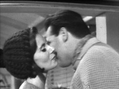 Fay kisses Steed goodbye. It must be winter, she’s wearing a knitted cap and he is wearing a thick woolen jumper