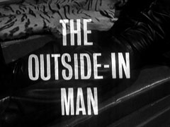 title card: white all caps text reading ‘THE OUTSIDE-IN MAN’ superimposed on a close-up of Cathy’s leather-clad bottom as she lies face down on the sofa, reading a book