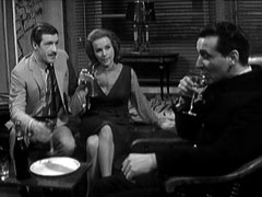 Mark, Cathy and Steed relax in Steed’s flat with a bottle of champagne after the case is over