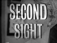title card: white all caps text reading ‘SECOND SIGHT’ superimposed with a black drop shadow on a close-up of the face of a marble bust