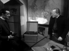 Steed confronts the Bishop with a revolver and rejects his last attempt at bribery