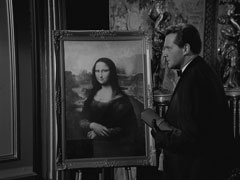 Steed, in evening wear, finds the Mona Lisa amongst Auntie’s stolen goods