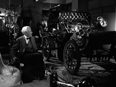 Kane, in his wheelchair, looks around at the old items in his Department of Discontinued Lines, marvelling at the craftsmanship that early machines had