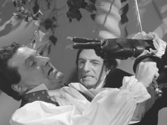Steed fight Willy, who tries to gouge his eyes with the hooks on his prosthetic fingers