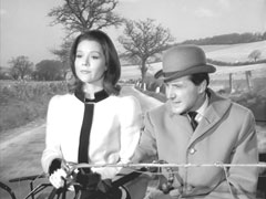 Steed quips about the passing ‘horseless carriage’ as Emma drives the stage coach away from Cartney’s house