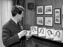 Miles finds himself surrounded by photographs of Emma