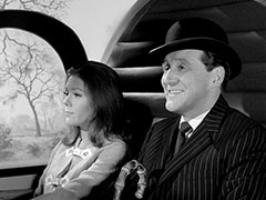 Emma and Steed prepare to depart in a helicopter