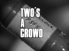 title card: white all caps text reading ‘TWO’S A CROWD’ outlined in black and superimposed on the wet message bomb