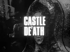 title card: white all caps text reading ‘CASTLE De’Ath’ outlined in black and superimposed on the head of an iron maiden