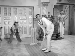 Prince Ali plays cricket in his throne room