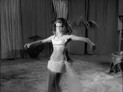 Emma performs the dance of the seven veils in appropriately Arabian attire
