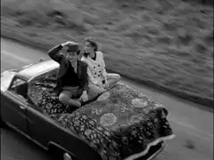 Steded and Emma fly away on a carpet - on the back of a van!