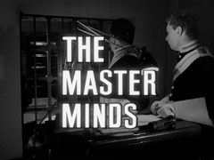title card: white all caps text reading ‘THE MASTER MINDS’ outlined in black and superimposed on the scene in the vault of the guardsmen looting the safe