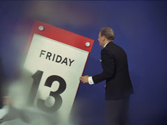 Inside the blue warehouse, Melford panics as he faces an outsized calendar showing FRIDAY 13