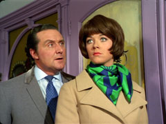 Tara is surprised when Steed leaps out behind her when she returns home