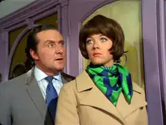Tara is surprised when Steed leaps out behind her when she returns home