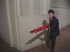 Steed stalks along the skirting board, wielding a (to him) huge pen as a weapon
