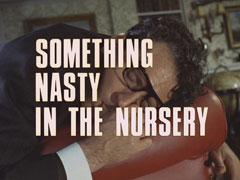 title card: white all caps text with black dropshadow to the left reading ‘SOMETHING NASTY IN THE NURSERY’ superimposed on a close-up of Dodson slumped over a red leather armchair, dead and sucking his thumb